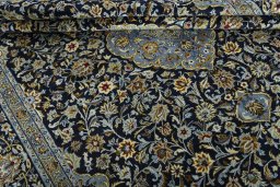 Close-up detail of 2000s Kashan rug from Iran / Persia showing Wool weave