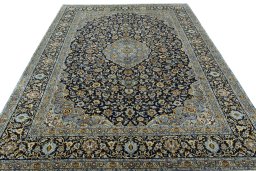Surface texture of 2000s Kashan rug with natural Wool and intricate pattern