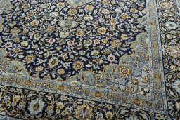 Close-up detail of 2000s Kashan rug from Iran / Persia showing Wool weave