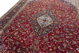Backside of handmade 2000s Kashan rug showing knot structure and weave density