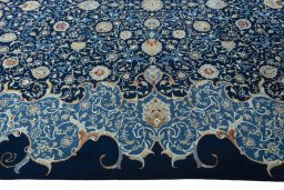 Corner detail of 2000s Kashan rug showing border pattern and Wool pile