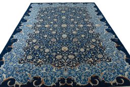 Surface texture of 2000s Kashan rug with natural Wool and intricate pattern