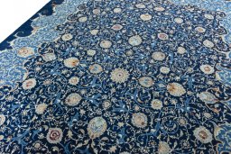 Backside of handmade 2000s Kashan rug showing knot structure and weave density