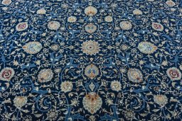 Central medallion detail of 2000s Kashan rug from Iran / Persia