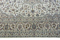 Corner detail of 2000s Kashan rug showing border pattern and Wool pile