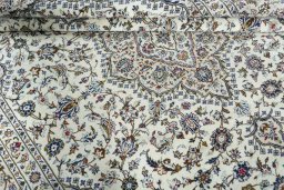 Close-up detail of 2000s Kashan rug from Iran / Persia showing Wool weave