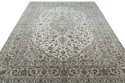 Surface texture of 2000s Kashan rug with natural Wool and intricate pattern