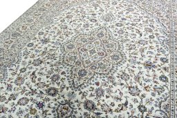 Backside of handmade 2000s Kashan rug showing knot structure and weave density