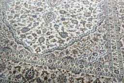 Close-up detail of 2000s Kashan rug from Iran / Persia showing Wool weave
