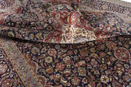Surface texture of 2000s Kashan rug with natural Cork and intricate pattern