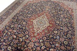 Backside of handmade 2000s Kashan rug showing knot structure and weave density