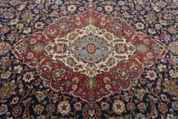 Central medallion detail of 2000s Kashan rug from Iran / Persia