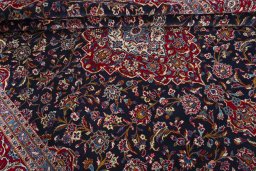 Close-up detail of 2000s Kashan rug from Iran / Persia showing Wool weave