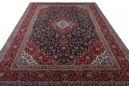 Surface texture of 2000s Kashan rug with natural Wool and intricate pattern