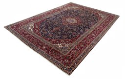 Corner detail of 1970s Kashan rug showing border pattern and Wool pile