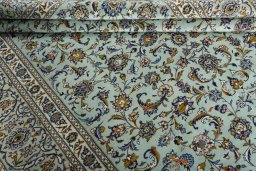 Close-up detail of 2000s Kashan rug from Iran / Persia showing Wool weave