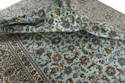 Surface texture of 2000s Kashan rug with natural Wool and intricate pattern