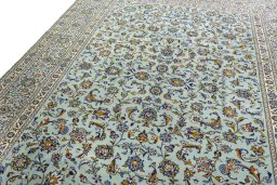 Backside of handmade 2000s Kashan rug showing knot structure and weave density