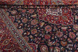 Close-up detail of 2000s Kashan rug from Iran / Persia showing Wool weave