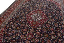 Backside of handmade 2000s Kashan rug showing knot structure and weave density