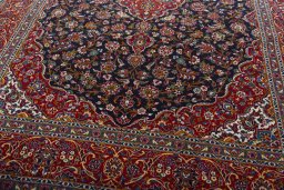 Close-up detail of 2000s Kashan rug from Iran / Persia showing Wool weave