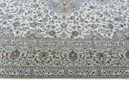 Corner detail of 2000s Kashan rug showing border pattern and Wool pile
