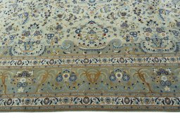 Corner detail of 2000s Kashan rug showing border pattern and Cork pile