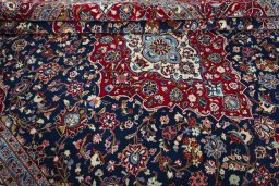 Close-up detail of 2000s Kashan rug from Iran / Persia showing Wool weave