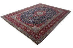 Corner detail of 2000s Kashan rug showing border pattern and Wool pile