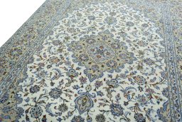 Backside of handmade 2000s Kashan rug showing knot structure and weave density