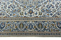 Corner detail of 2000s Kashan rug showing border pattern and Wool pile