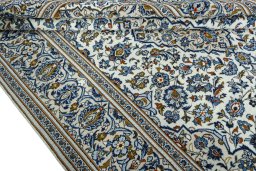 Close-up detail of 2000s Kashan rug from Iran / Persia showing Wool weave