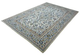 Corner detail of 2000s Kashan rug showing border pattern and Wool pile