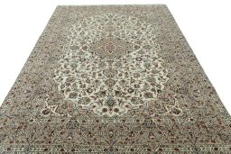 Surface texture of 2000s Kashan rug with natural Wool and intricate pattern