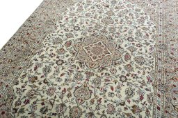 Backside of handmade 2000s Kashan rug showing knot structure and weave density