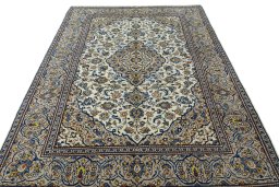 Surface texture of 2000s Kashan rug with natural Wool and intricate pattern