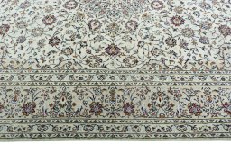 Corner detail of 2000s Kashan rug showing border pattern and Wool pile