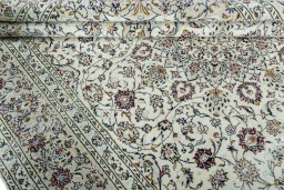 Close-up detail of 2000s Kashan rug from Iran / Persia showing Wool weave