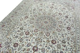 Backside of handmade 2000s Kashan rug showing knot structure and weave density