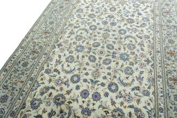 Backside of handmade 2000s Kashan rug showing knot structure and weave density