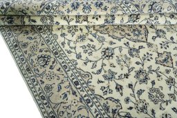 Close-up detail of 2000s Kashan rug from Iran / Persia showing Wool weave