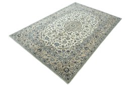 Corner detail of 2000s Kashan rug showing border pattern and Wool pile