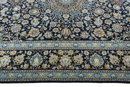 Corner detail of 2000s Kashan rug showing border pattern and Wool pile