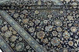 Close-up detail of 2000s Kashan rug from Iran / Persia showing Wool weave