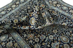 Surface texture of 2000s Kashan rug with natural Wool and intricate pattern