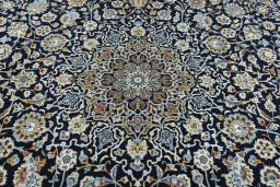 Central medallion detail of 2000s Kashan rug from Iran / Persia