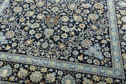 Close-up detail of 2000s Kashan rug from Iran / Persia showing Wool weave