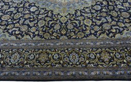 Corner detail of 1970s Kashan rug showing border pattern and Wool pile