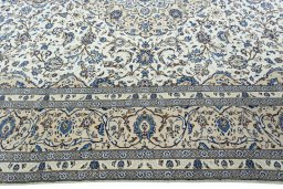 Corner detail of 2000s Kashan rug showing border pattern and Wool pile