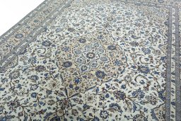 Backside of handmade 2000s Kashan rug showing knot structure and weave density